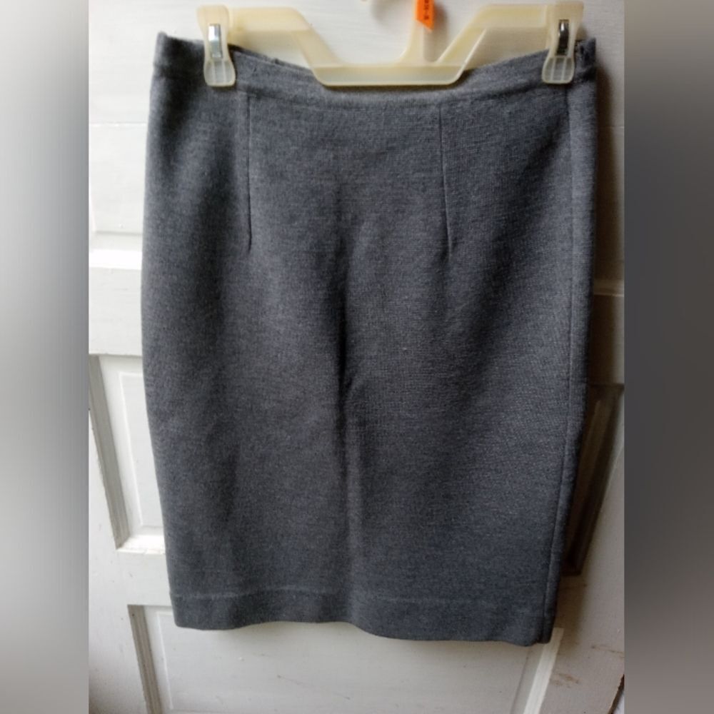100% Wool Pencil Skirt with side zipper. Made in Italy.Some minor defects in pic